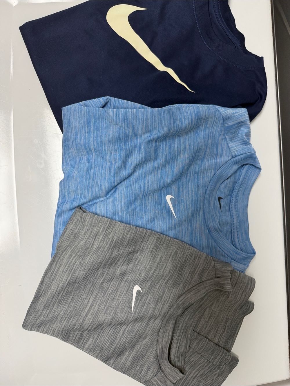 Boys size large trio of Nike shirts